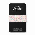 A black rectangular card or mini package for Luxe Washi, featuring a horizontal strip of pastel multicolor alphabet washi tape across the center. White text on the black card reads 'Luxe Washi' at the top and 'Luxe Washi Mini / The Jadore Studio' at the bottom, shown on a light gray background.
