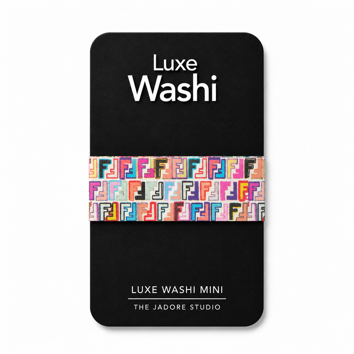 A package of Luxe Washi Mini washi tape by The Jadore Studio, featuring a black backing card with white text and a colorful patterned tape strip across the middle.