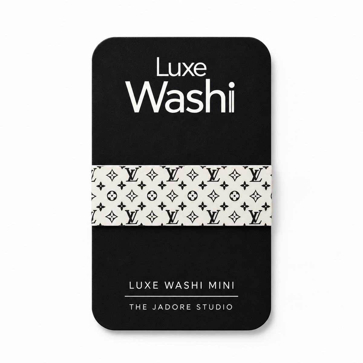 A black rectangular card or mini package with rounded corners, featuring the text 'Luxe Washi' at the top and 'Luxe Washi Mini' at the bottom, plus 'THE JADORE STUDIO.' A horizontal band across the center shows a repeating black monogram pattern on an off-white background.